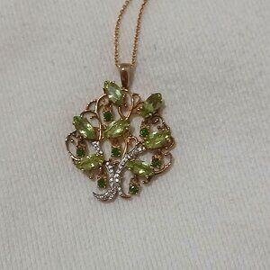 925 gold toned tree necklace with peridot.
